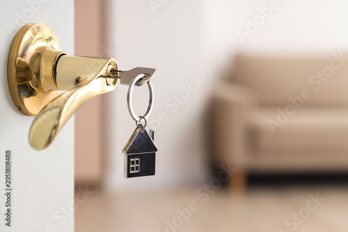 Open door with key in rente...