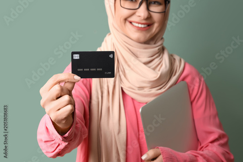Muslim woman with credit ca...