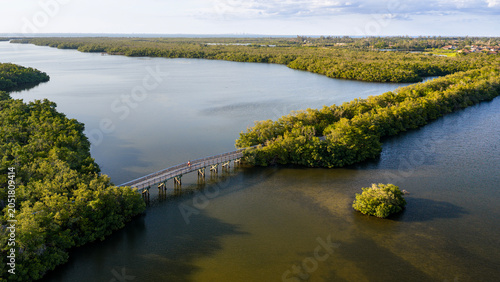 Quadro su tela Golden hour aerial view of a scenic wooden footbridge crossing Perico Bayou at Robinson Preserve in Bradenton, FL