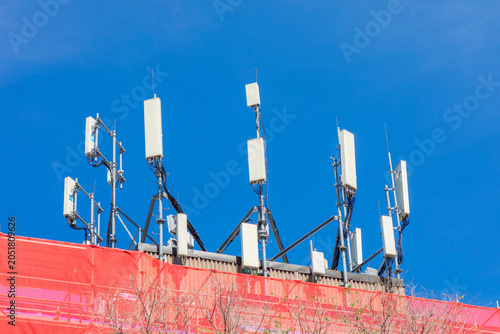 Photography Hi-tech cellphone antennas are seen on a downtown roof.