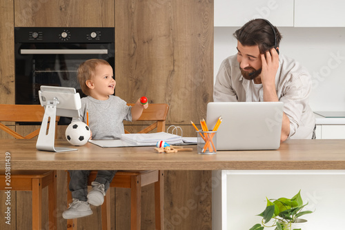 Stressed father with his li...