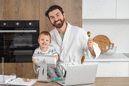 Working father with toy and...