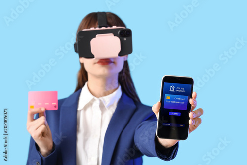 Young businesswoman in VR g...