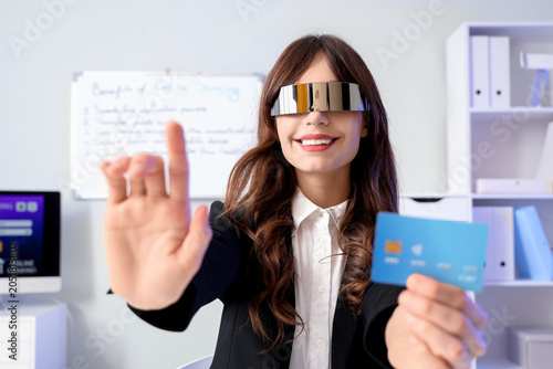 Young businesswoman in AR g...