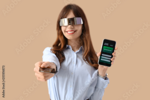 Young businesswoman in AR g...