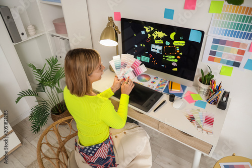 Female web designer with co...