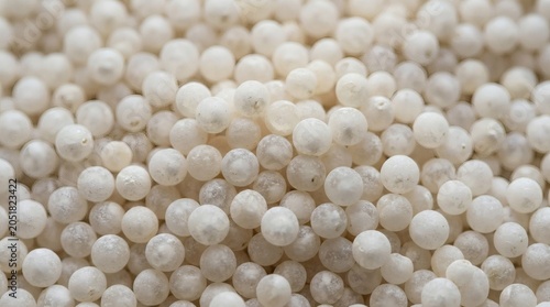 Raw dry sago pearls macro.