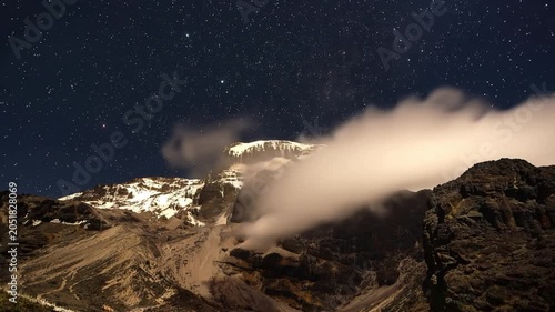 Mount Kilimanjaro. Kilimanjaro National Park in Tanzania, Africa. Trekking and climbing to the summit. Time lapse. Night video in starry sky.