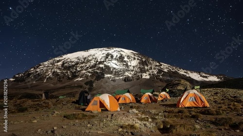 Mount Kilimanjaro. Kilimanjaro National Park in Tanzania, Africa. Trekking and climbing to the summit. Time lapse. Night video in starry sky. Tent