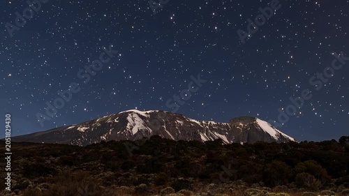 Mount Kilimanjaro. Kilimanjaro National Park in Tanzania, Africa. Trekking and climbing to the summit. Time lapse. Night video in starry sky.