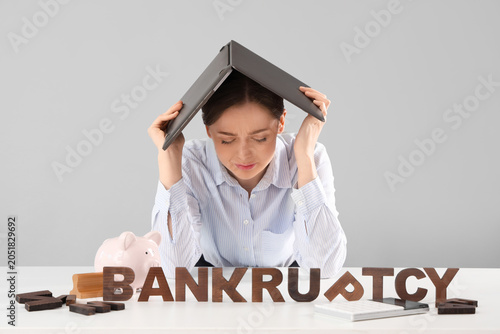 Stressed businesswoman with...