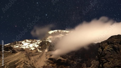 Mount Kilimanjaro. Kilimanjaro National Park in Tanzania, Africa. Trekking and climbing to the summit. Time lapse. Night video in starry sky.