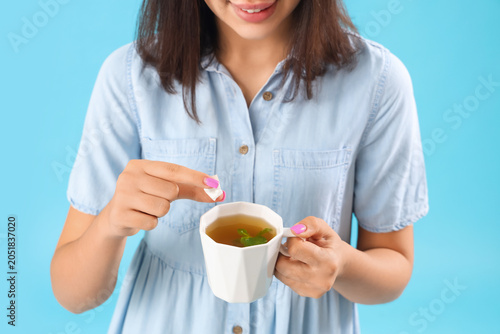 Young woman with sugar and ...