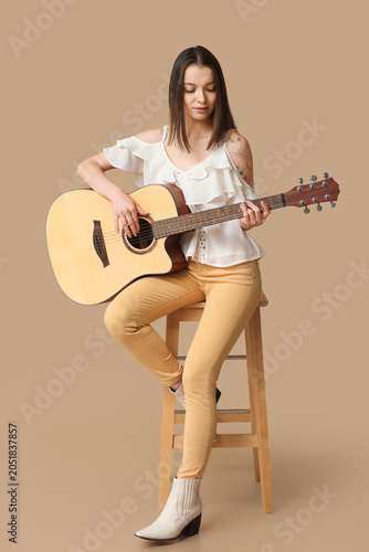 Pretty young woman playing ...