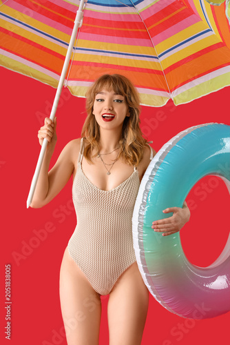Young woman with beach umbr...