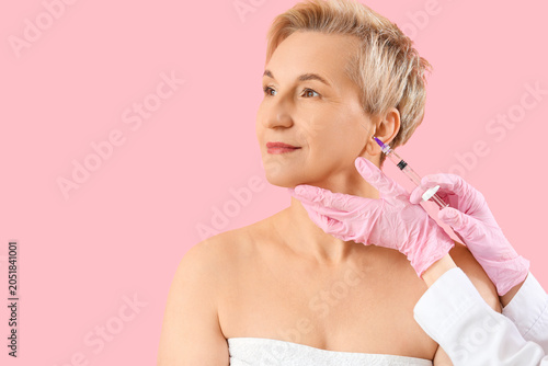 Mature woman receiving fill...