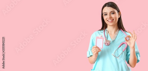 Smiling female doctor in sc...