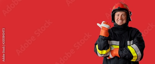 Smiling firefighter in prot...