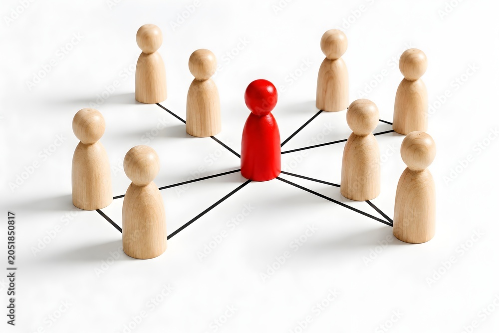 Obraz premium Red Wooden Figure Connected to Network of Plain Pegs Representing Leadership Teamwork and Communication