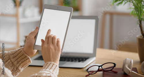 Young woman using modern ta...