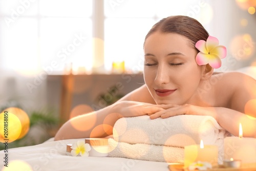 Relaxed woman with plumeria...