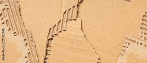 Torn pieces of cardboard as...