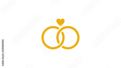 Golden wedding rings with heart symbol.