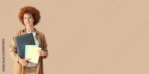 Smiling young woman with cu...