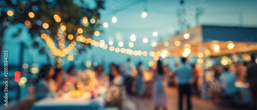 Evening gathering scene with bokeh lights and people celebrating outdoors