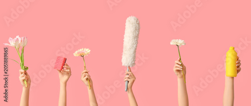 Many female hands with bott...