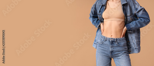 Young woman in denim jacket...