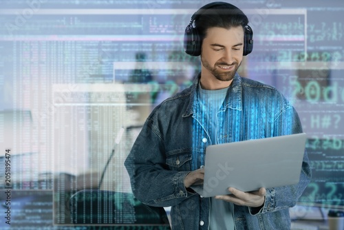 Smiling male programmer in ...