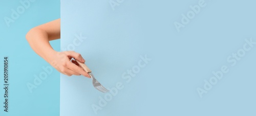 Human hand holding silver f...
