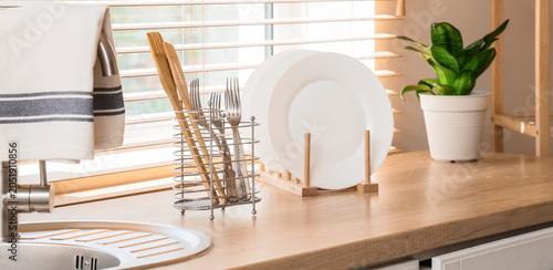 Holders with cutlery and di...