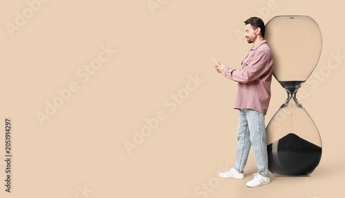 Man using smartphone leanin...
