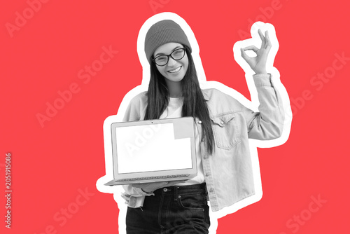 Young woman with blank lapt...