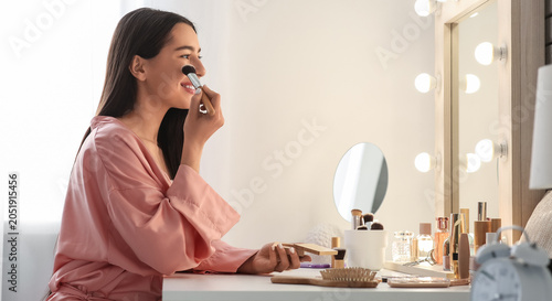 Morning of young woman doin...