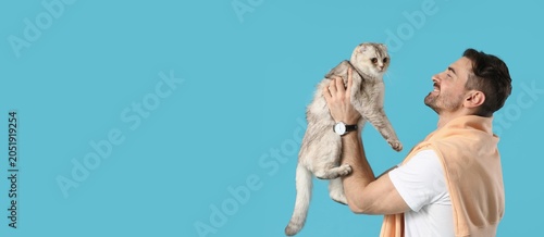 Happy man holding adorable ...