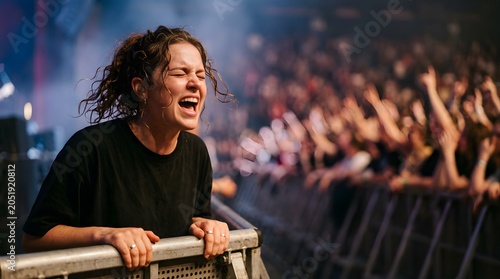 Excited woman singing along at a live music concert in front of a crowd