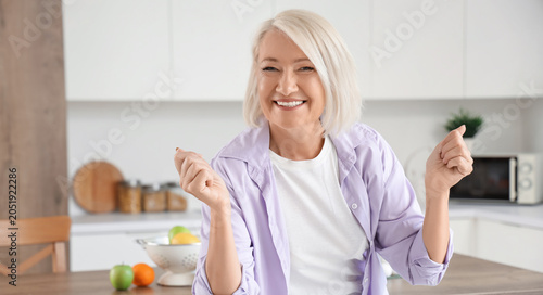 Mature woman dancing in kit...