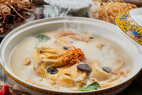 Obraz na plátně Fish maw, kudzu root, and stewed free-range chicken soup in a round porcelain bo
