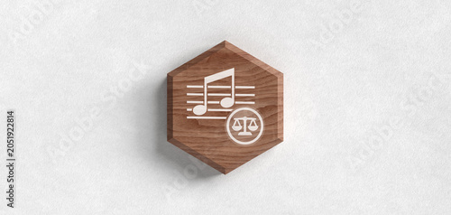 Foto A wooden hexagon with music notes and a justice scale icon on white paper, representing music law, copyright protection, legal rights for composers, and intellectual property
