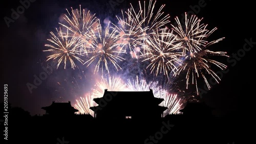 Stunning Fireworks Display Illuminating Ancient Structure at Night