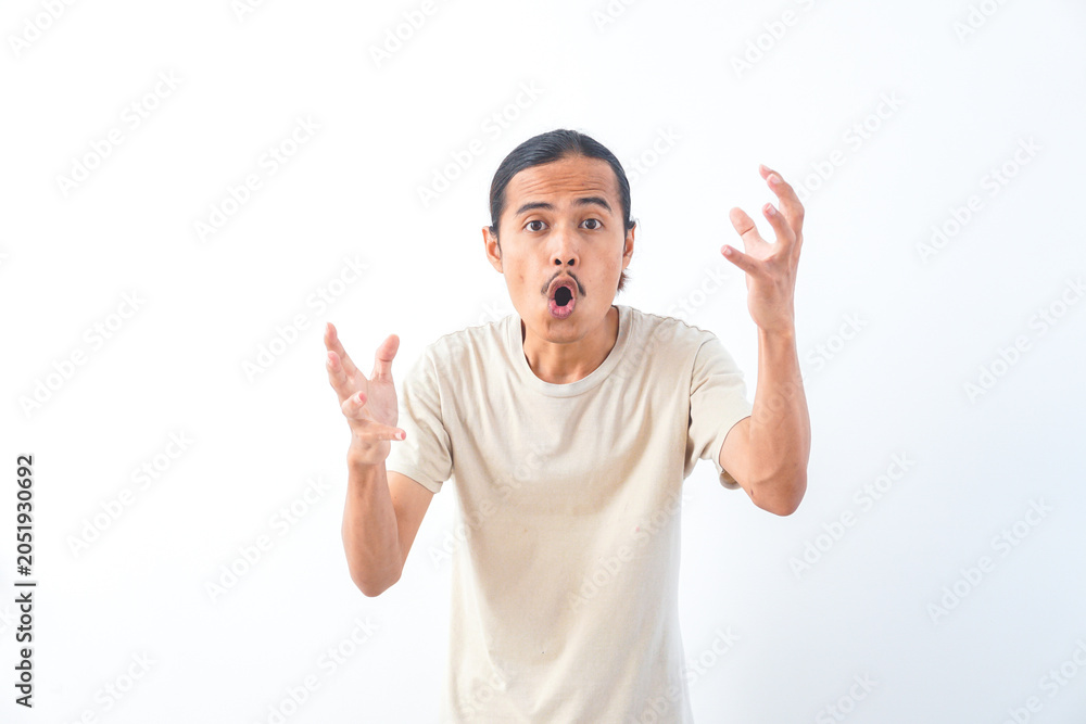 Fototapeta premium Young Asian man in a shirt, with a shocked face expression. Isolated on a white background
