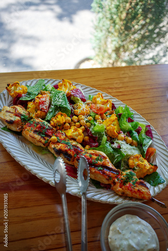 Close-up of grilled chicken breast and cauliflower salad