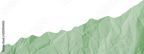 Horizontal torn green crumpled paper border. Ripped blank wavy colored sheet strip isolated on dark background for grunge collage text mockup.