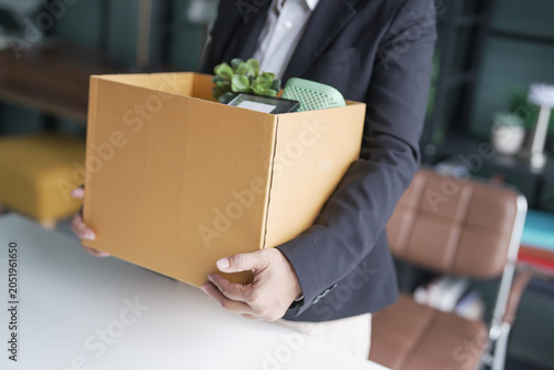 Quit Job senior asian business woman sending resignation letter and packing Stuff Resign Depress or carrying business cardboard box in office layoff retired from company