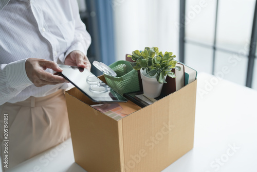 Quit Job senior asian business woman sending resignation letter and packing Stuff Resign Depress or carrying business cardboard box in office layoff retired from company
