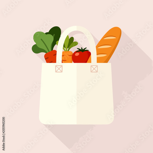A white reusable shopping bag filled with fresh organic produce items