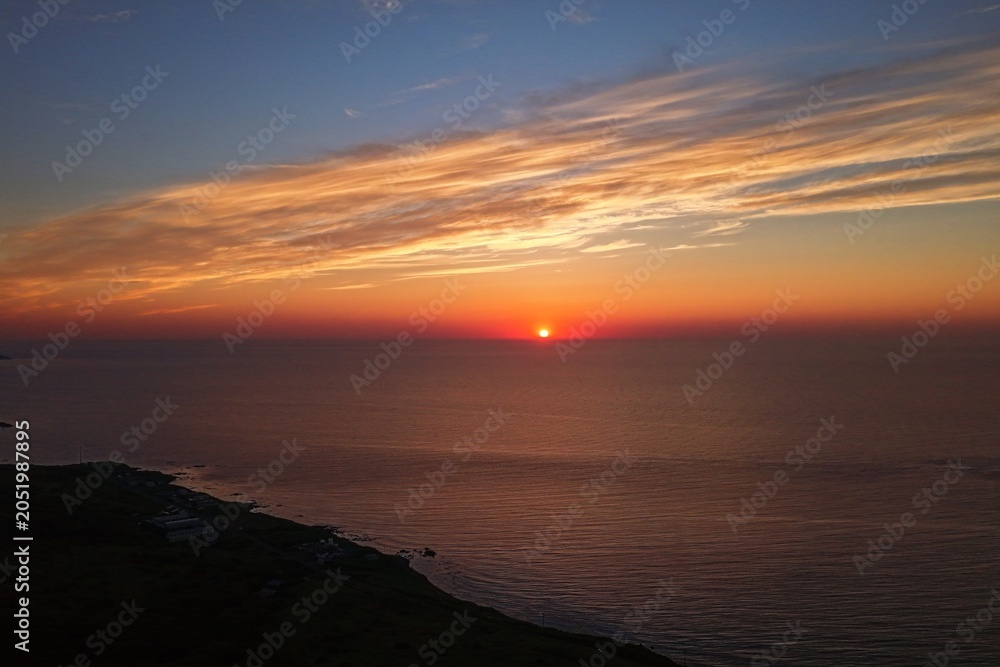 Fototapeta premium Aerial drone photo of sunset over the sea from Yagishiri Island, Hokkaido, Japan